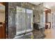 Large walk-in shower with marble surround at 1067 Westway Dr, Sarasota, FL 34236