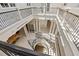 Impressive spiral staircase viewed from above, showcasing an open floor plan at 1067 Westway Dr, Sarasota, FL 34236