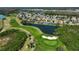 An aerial view of the community, highlighting the beautiful golf course, water features, and lush landscaping at 10726 Old Grove Cir, Bradenton, FL 34212
