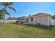 Expansive backyard showing a screened-in pool, manicured lawn, and mature landscaping at 10726 Old Grove Cir, Bradenton, FL 34212