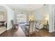 The living room offers hardwood floors and beautiful views of the screened in pool at 10726 Old Grove Cir, Bradenton, FL 34212