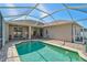 Relaxing screened-in pool area with a paved patio and seamless access to the home at 10726 Old Grove Cir, Bradenton, FL 34212