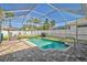 Inviting screened-in pool surrounded by brick pavers and manicured landscaping at 10726 Old Grove Cir, Bradenton, FL 34212