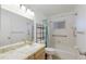 Bright bathroom featuring a vanity, toilet, shower, and bathtub combination at 1208 Francis Ave, Sarasota, FL 34232