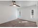 Bright bedroom with carpet, white walls, and two windows offering sunlight and views at 1208 Francis Ave, Sarasota, FL 34232