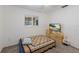 Bright bedroom with neutral carpet, a window, and a TV at 1208 Francis Ave, Sarasota, FL 34232