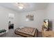 Simple bedroom featuring neutral carpet, a window, and closet access at 1208 Francis Ave, Sarasota, FL 34232
