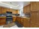 Kitchen features wood cabinets, wood counters, tile backsplash, and stainless steel appliances at 1208 Francis Ave, Sarasota, FL 34232