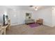 Inviting living room with neutral carpet and a view of the front door at 1208 Francis Ave, Sarasota, FL 34232