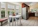 Eat-in breakfast nook with built-in seating and views into kitchen at 1358 Berkshire Ct, Venice, FL 34292