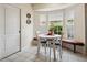 Cozy breakfast nook featuring bright windows and built in seating at 1358 Berkshire Ct, Venice, FL 34292