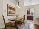 View of the dining room showcasing elegant wooden furniture and natural lighting at 1358 Berkshire Ct, Venice, FL 34292