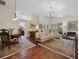 Elegant living room featuring hardwood floors, ample seating, and a bright, airy atmosphere at 1358 Berkshire Ct, Venice, FL 34292