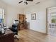 Bright office features wood floors, ample storage, a ceiling fan and natural light at 1358 Berkshire Ct, Venice, FL 34292