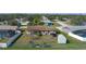 Aerial view of home with a fenced-in backyard and a shed at 1406 14Th Street W Ct, Palmetto, FL 34221