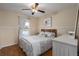 Bedroom featuring a ceiling fan, a queen bed and a window with natural light at 1406 14Th Street W Ct, Palmetto, FL 34221