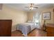 Comfortable bedroom features a bed, ceiling fan and a window offering natural light at 1406 14Th Street W Ct, Palmetto, FL 34221