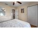 Bedroom featuring a ceiling fan, a closet, and a full size bed at 1406 14Th Street W Ct, Palmetto, FL 34221