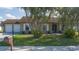 Charming single-story house with palm trees and stone accents at 1406 14Th Street W Ct, Palmetto, FL 34221
