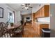 Charming kitchen and breakfast nook featuring wood cabinets and an eat-in area that leads to the living room at 1406 14Th Street W Ct, Palmetto, FL 34221
