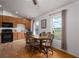 A charming kitchen features wooden cabinets, a full appliance package, and a cozy dining area with natural light at 1406 14Th Street W Ct, Palmetto, FL 34221