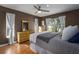 Cozy bedroom with brown walls, natural light, and stylish wicker dressers, creating a serene retreat at 1406 14Th Street W Ct, Palmetto, FL 34221