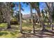 Manicured backyard featuring a screened porch that combines indoor-outdoor living at 1529 Oak Way, Sarasota, FL 34232