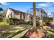 Manicured backyard featuring a screened porch that combines indoor-outdoor living at 1529 Oak Way, Sarasota, FL 34232