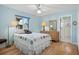 Bedroom featuring natural light, ceiling fan, and dresser with decorative mirror at 1529 Oak Way, Sarasota, FL 34232