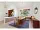 Bright dining room featuring stylish decor, a chandelier, and plenty of natural light at 1529 Oak Way, Sarasota, FL 34232