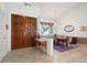 Open foyer with tile flooring, high ceilings, and an elegant dining area at 1529 Oak Way, Sarasota, FL 34232