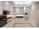 Bright kitchen with granite countertops and custom white cabinets at 1529 Oak Way, Sarasota, FL 34232