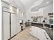 Open floor plan with kitchen featuring granite countertops and custom white cabinets at 1529 Oak Way, Sarasota, FL 34232