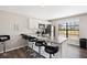 Stylish kitchen featuring white cabinets, granite countertop, and modern stainless steel appliances at 1529 Oak Way, Sarasota, FL 34232