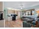 Living room with built-in shelving, desk area, large windows, and comfortable seating at 1529 Oak Way, Sarasota, FL 34232