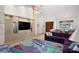 Spacious living room with vaulted ceilings, custom built-ins, and an open floor plan at 1529 Oak Way, Sarasota, FL 34232