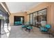 Outdoor patio with tile flooring, comfortable seating, and a ceiling fan for warm weather at 1529 Oak Way, Sarasota, FL 34232