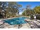 Community pool and spa area with lounge chairs for relaxation and enjoyment at 1529 Oak Way, Sarasota, FL 34232