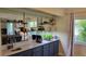 Modern kitchenette with granite countertops and decorative shelves at 2018 N Pebble Beach Blvd, Sun City Center, FL 33573