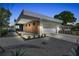 Modern home with clean lines, light color scheme, and landscaped yard at 2149 Hyde Park St, Sarasota, FL 34239