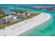 Spectacular aerial view of a white sandy beach and resort-style condos along the Gulf Coast at 225 Sands Point Rd # 6204, Longboat Key, FL 34228