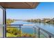 Enjoy waterfront views from this condo balcony, with glass railings and ample space for outdoor seating at 225 Sands Point Rd # 6204, Longboat Key, FL 34228