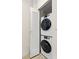 Practical laundry closet featuring stacked washer and dryer units at 225 Sands Point Rd # 6204, Longboat Key, FL 34228