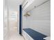 Neat closet with organized storage space and a comfortable cushioned seat at 225 Sands Point Rd # 6204, Longboat Key, FL 34228