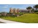 Elegant Sarasota National entrance sign featuring stone accents, water features, and manicured landscaping at 23189 Banbury Way # 203, Venice, FL 34293