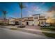 Charming townhome with a well-kept exterior, featuring attached garages and a lovely brick driveway at 23189 Banbury Way # 203, Venice, FL 34293