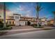 Beautiful townhome exterior with manicured landscaping, brick driveway, and attached garages, perfect for modern living at 23189 Banbury Way # 203, Venice, FL 34293