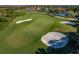 Aerial view of a perfectly manicured golf course with lush green grass at 23189 Banbury Way # 203, Venice, FL 34293