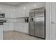 Modern kitchen featuring stainless steel appliances, white cabinets, and stylish countertops at 23189 Banbury Way # 203, Venice, FL 34293