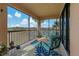 Relax on the lanai with comfortable chairs while taking in the tranquil view of the pond at 23189 Banbury Way # 203, Venice, FL 34293
